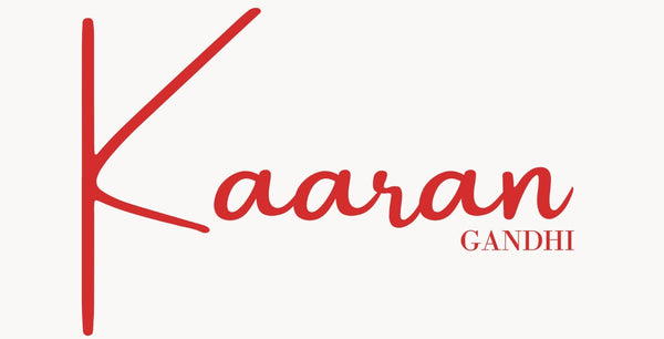 Red 'Kaaran Gandhi' logo on a white background